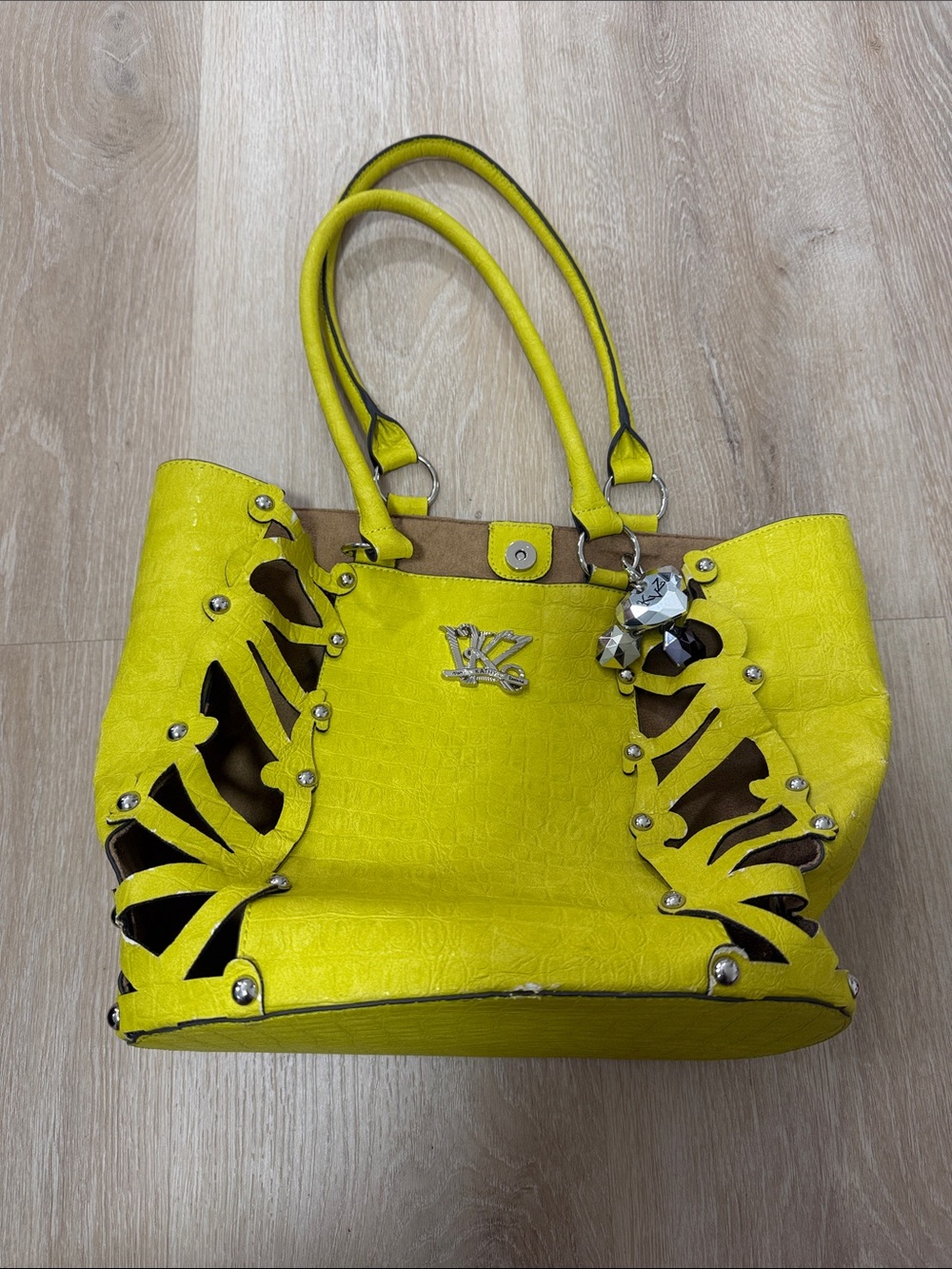 Kathy Van Zeeland Yellow Cutout Tote with Jewel Charm